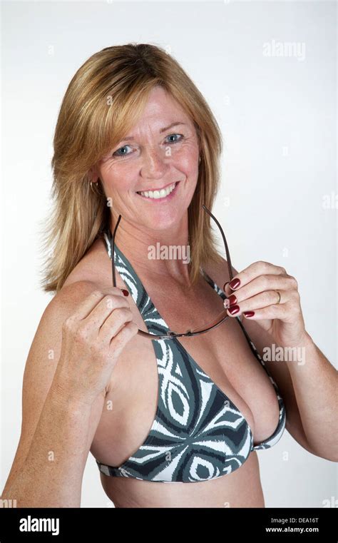 Woman Wearing Bikini Top And Holding Sunglasses Stock Photo Alamy
