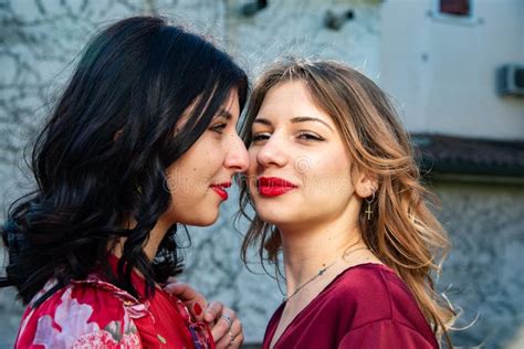 Close Up Of Two Lesbian Friends One Blonde And The Other Brunette Are