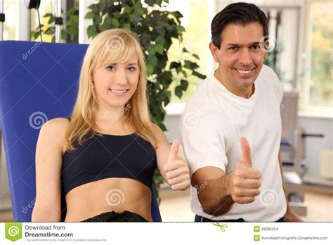 Attractive Blonde Woman And Her Trainer In A Gym Stock Photo Image Of Body Health 28385354