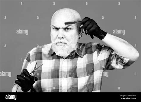 Old Hairdresser Mature Barber Portrait Of Senior Barber Holding Barber Equipments Isolated On
