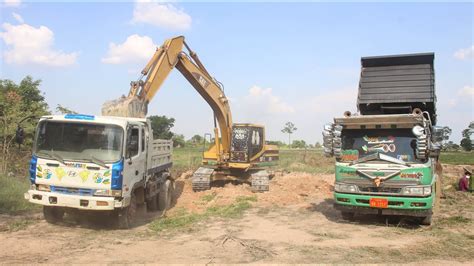 Caterpillar C Excavator Landing Land On Trucks Youtube