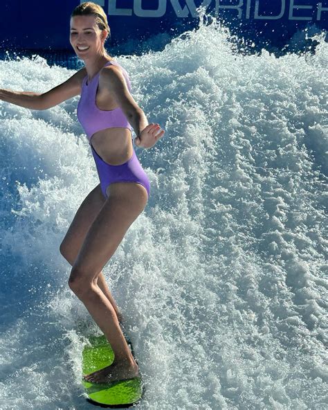 Ivanka Trump wipes out while surfing in purple swimsuit