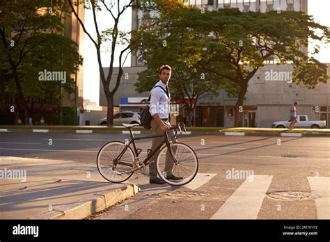 Getting Around The Green Way A Businessman Commuting To Work With His