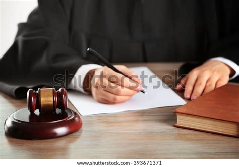 Judge Writing On Paper Gavel On Stock Photo Edit Now