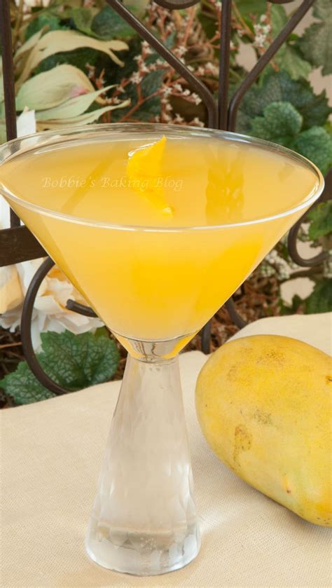 Mango Martini • 2 Ounces Ruby Red Vodka •2 Ounce Mango Vodka •1 2 Lemon Freshly Squeezed •1 1