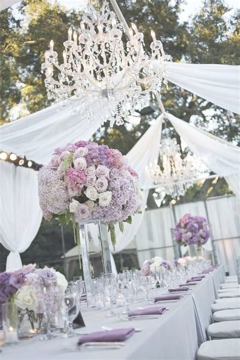 An Image Of A Table Set Up For A Wedding Reception With Flowers And