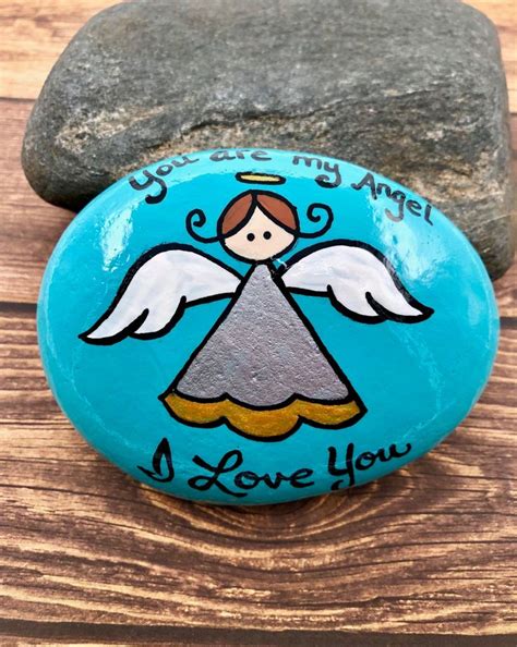 A Rock With An Angel Painted On It And The Words You Re My Angel I