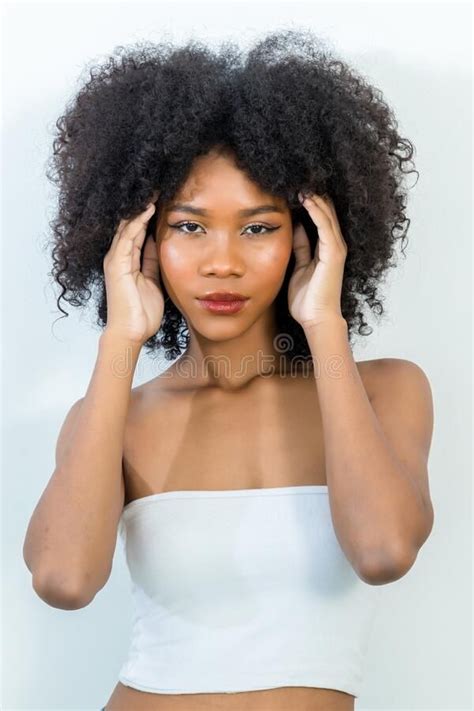 Portrait Of African American Woman With Bushy Curly Hairstyle Stock