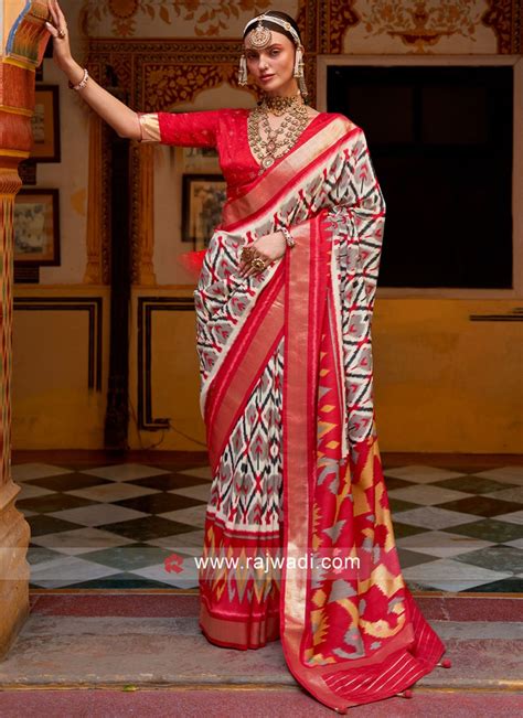 Spectacular White And Red Weaving Patola Silk Saree