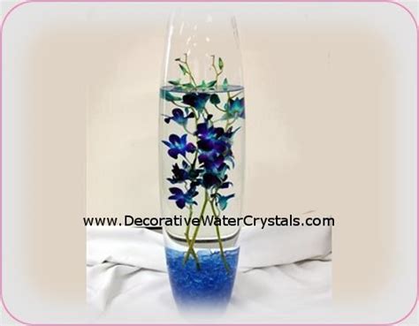 Blue orchids | Blue orchid centerpieces, Vase centerpieces, Wedding table centerpieces