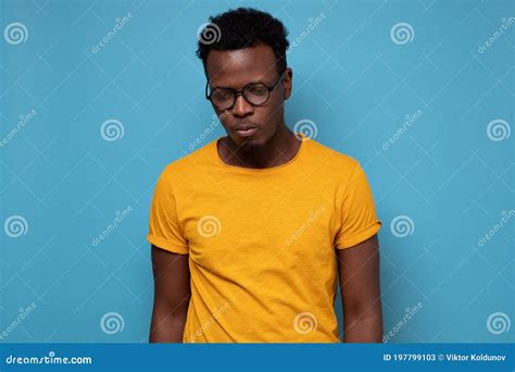 Portrait Of Handsome African American Man In Glasses Looking Sad Stock