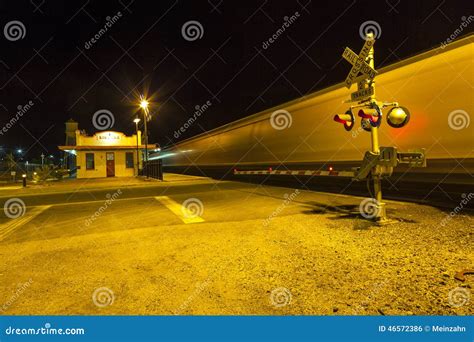 Railroad Crossing With Passing Train By Night Stock Photo Image Of