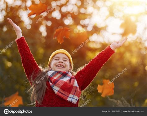 Child playing with autumn leaves Stock Photo by ©choreograph 165320152