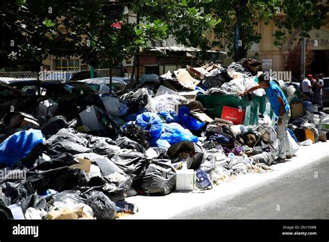 A Lebanese Man Searches For Valuables Amongst The Garbage On A Beirut