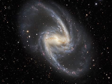 Barred Spiral Galaxy Ngc 1365 This Image Shows The Galaxys Prominent