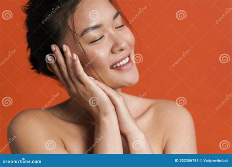 Image Of Shirtless Asian Girl Posing And Smiling At Camera Stock Image