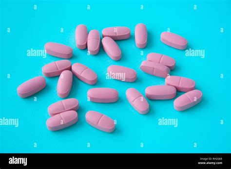 Calcium Pink Pills Close Up On Blue Background Medicine Concept Food Supplements Concept Stock