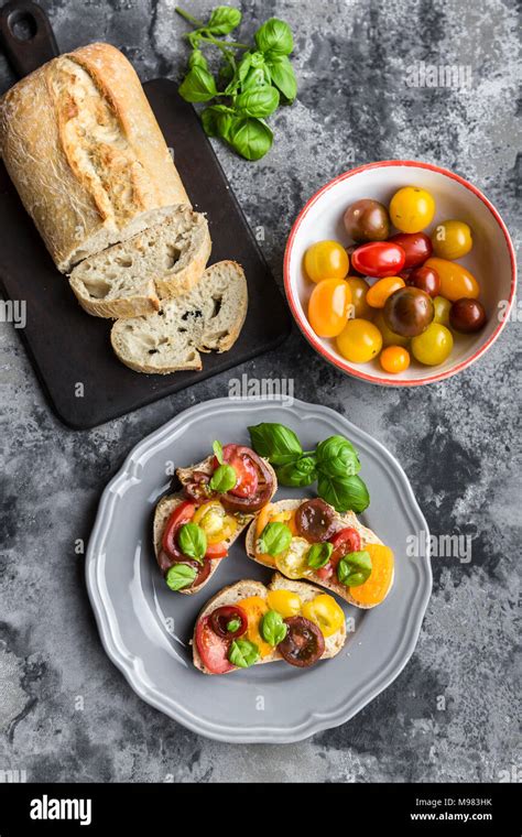 Bruschetta Ciabatta With Multi Coloured Tomatoes And Basil Stock Photo