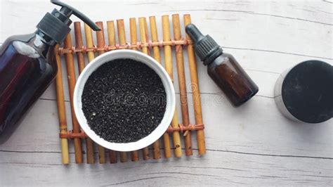 Black Cumin In A Container And Oil On Table Stock Footage Video Of