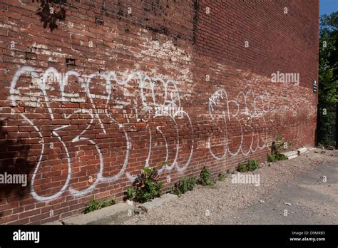 Graffiti On Side Of Brick Building Usa Stock Photo Alamy