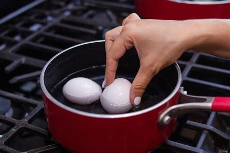 Premium Photo Young Girl Prepares Beautiful Eggs In Skillet For Breakfast