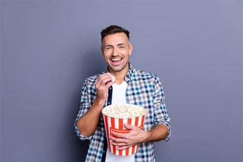 Man Eating Popcorn Stock Photos Pictures And Royalty Free Images Istock