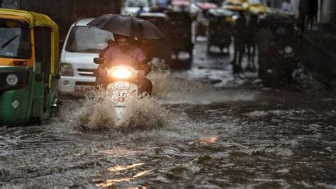 Photos Heavy Rain In Delhi Ncr Causes Traffic Jams Waterlogging