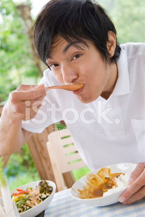 Man Eating Curry And Rice Stock Photos
