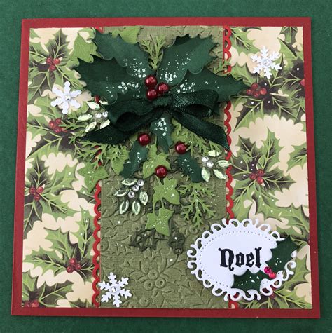 A Christmas Card With Holly And Poinsettis