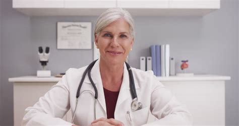 Beautiful Mature Medical Doctor Consulting With Patient Pov Stock Footage Video 13243979