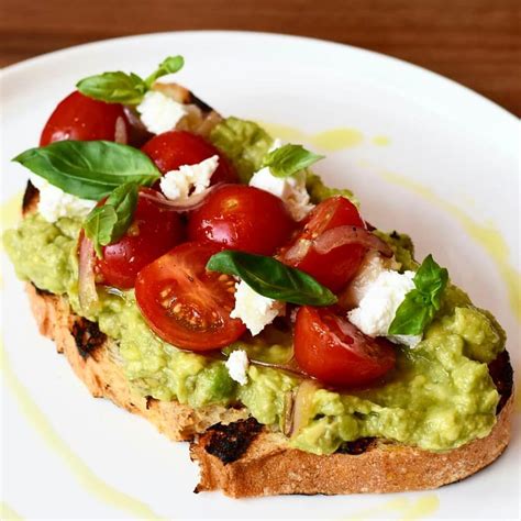 Avocado Toast Topped With Cherry Tomatoes Feta By Anne Travel