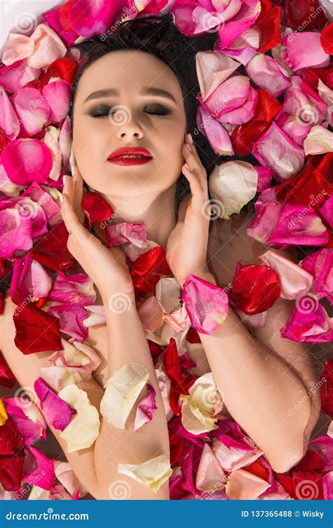 Sensual Woman Lying In Water And Rose Petals Stock Photo Image Of