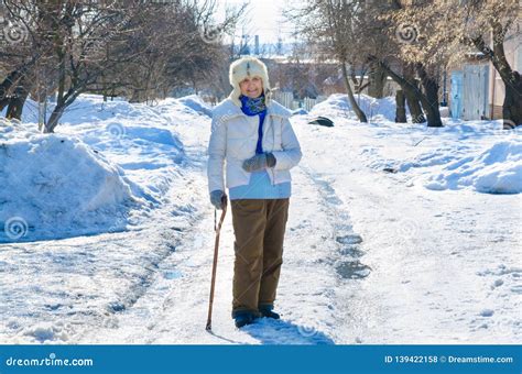 Grandmother With Cane On Road In Park Old Person Leaning On A Walking