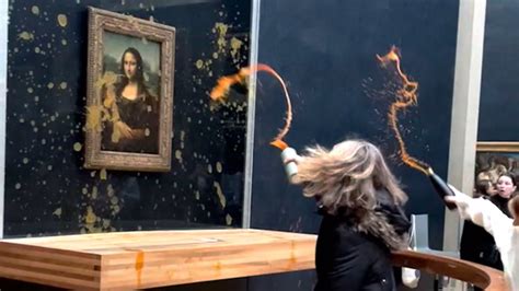 Moment protesters throw soup at Mona Lisa in Paris