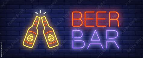 Beer Bar Neon Sign Glowing Inscription With Two Beer Bottles On Dark Blue Brick Background