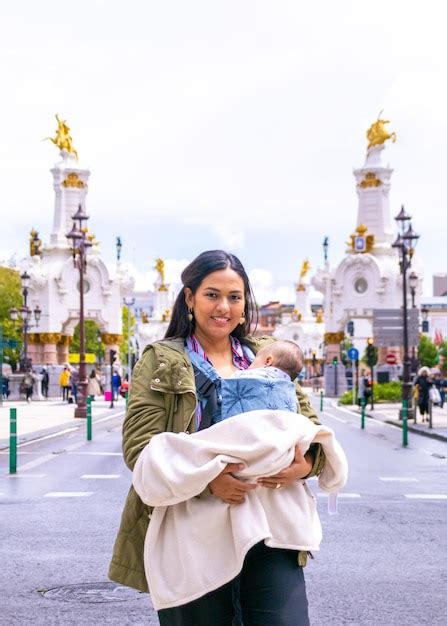 Premium Photo Latin Mom With Baby In Baby Carrier On The Maria