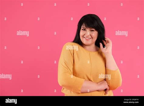 Beautiful Overweight Mature Woman With Charming Smile On Pink