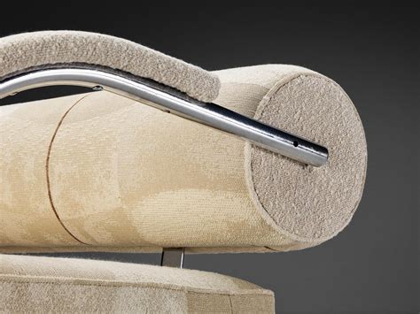 Sofa With Tubular Frame And Beige Upholstery