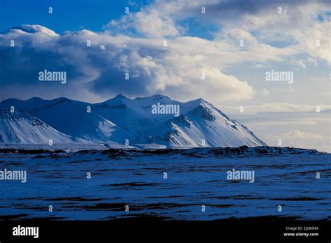 A scenic landscape with snowy mountains in Iceland Stock Photo - Alamy