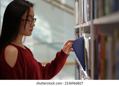 Asian Student Girl Standing Between Library Stock Photo 2136966827