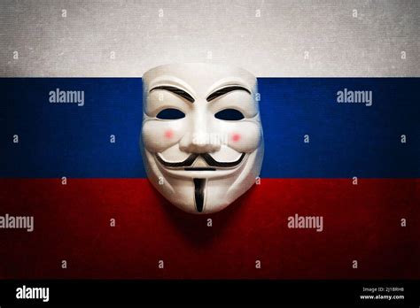 Hacker Mask On A Computer Screen With The Background Of The Russian