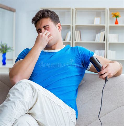 Man Sweating Excessively Smelling Bad At Home Stock Photo Image Of