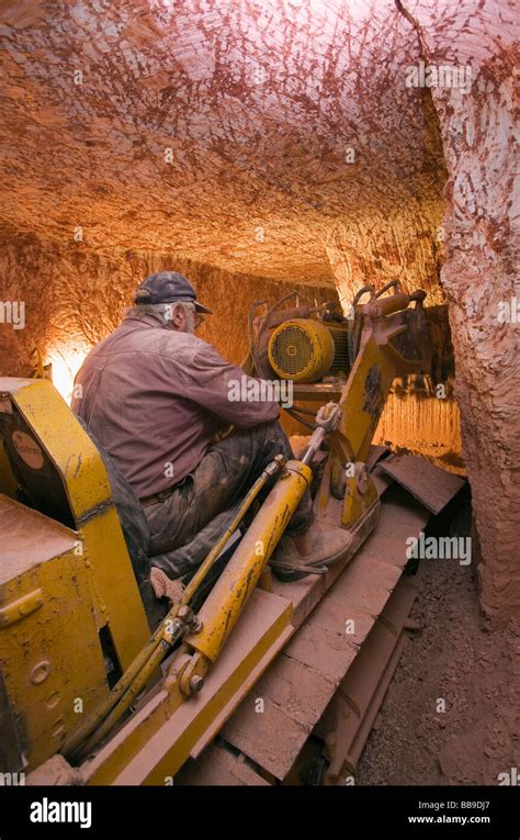 Tunneling machine on a drive (digging a horizontal tunnel) along the opal seam. Coober Pedy ...