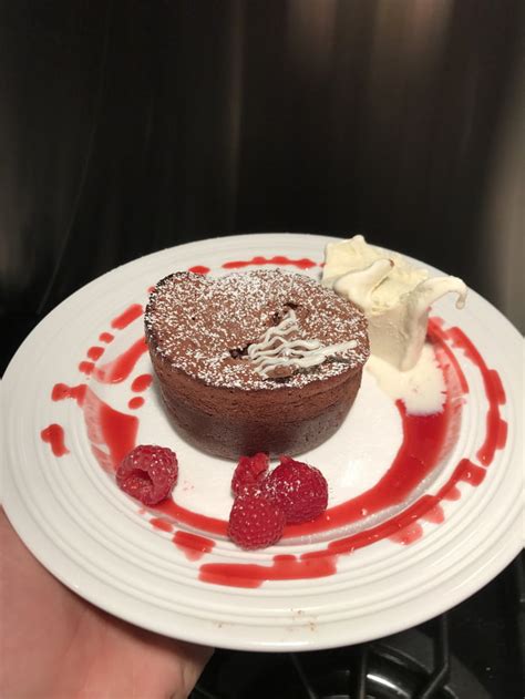 Molten Chocolate Cake with vanilla ice cream and raspberry sauce. - 9GAG