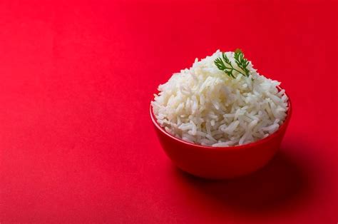 Premium Photo Cooked Plain White Basmati Rice In A Red Bowl On Red