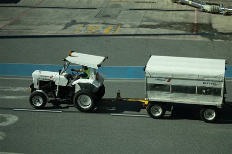 High Angle Shot of a Tractor Pulling a Trailer · Free Stock Photo