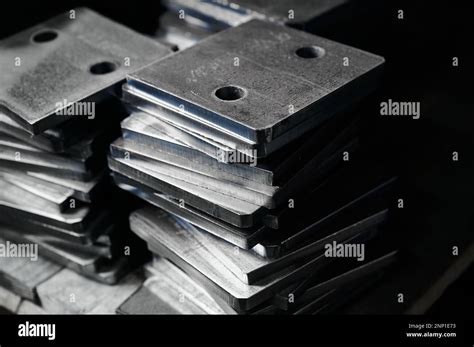 Stacks Of Metal Plates With Holes In Plant Storehouse Stock Photo Alamy