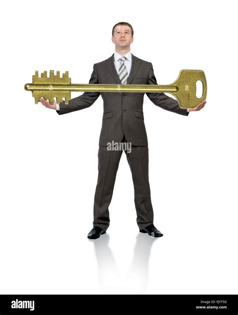 Businessman Holding Big Gold Key Stock Photo Alamy