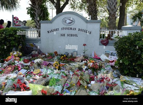 Parkland FL, USA. 23rd Feb, 2018. Students visit memorial for Stoneman ...