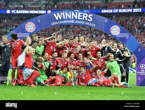 Bayern Munich Players Celebrate With The Uefa Champions League Trophy